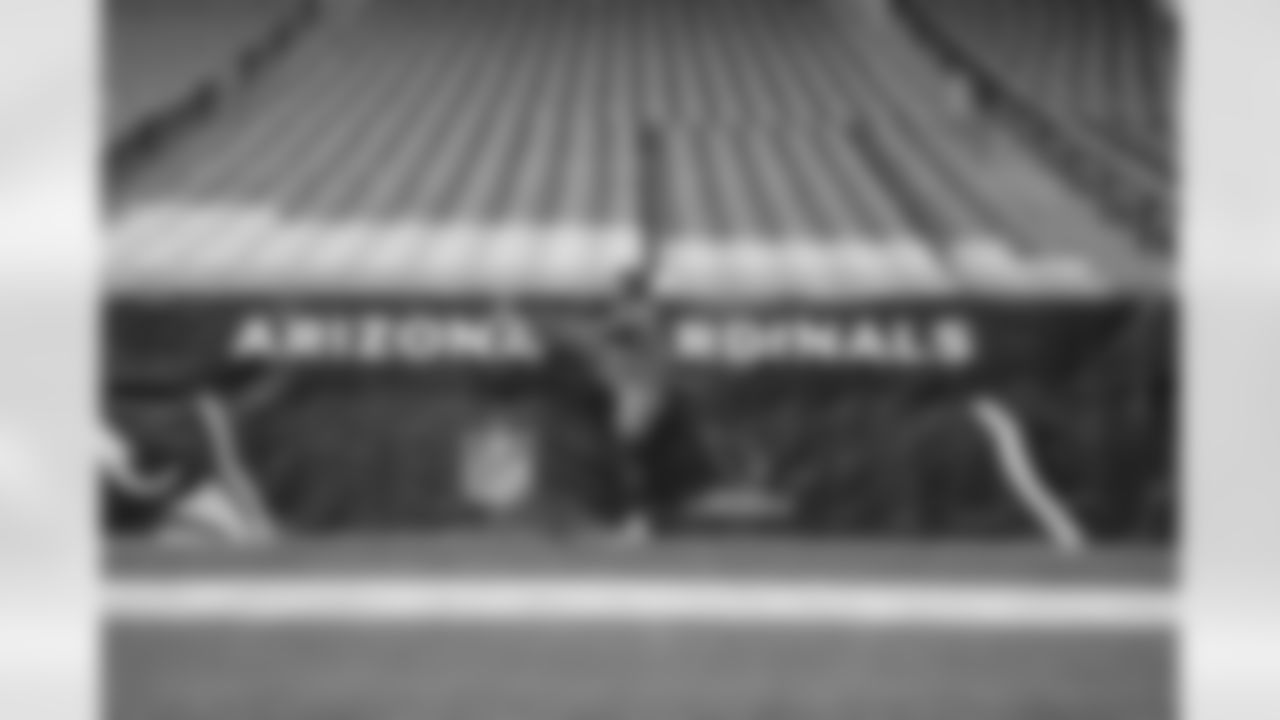 The Los Angeles Chargers prepare to play against the Arizona Cardinals at State Farm Stadium on November 27, 2022 in Glendale, Arizona.