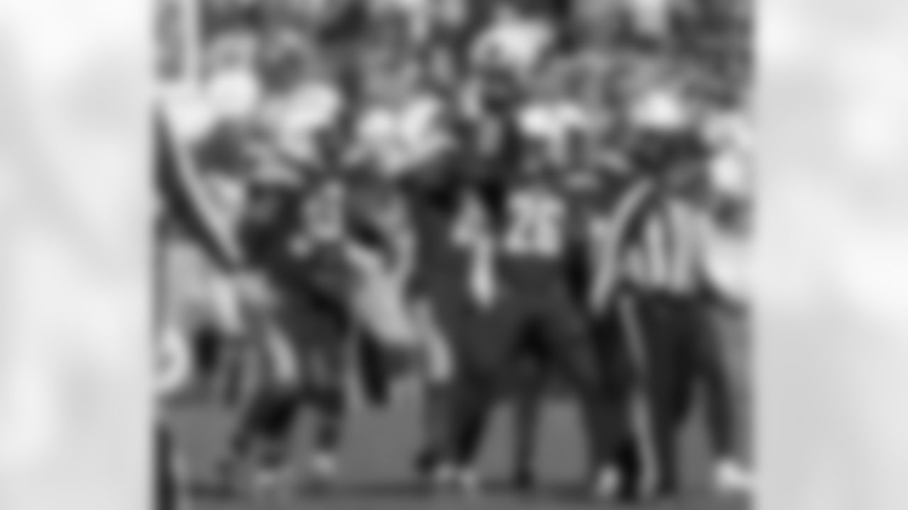 Desmond King celebrates his second interception of the day during the Week 6 matchup against the Cleveland Browns.