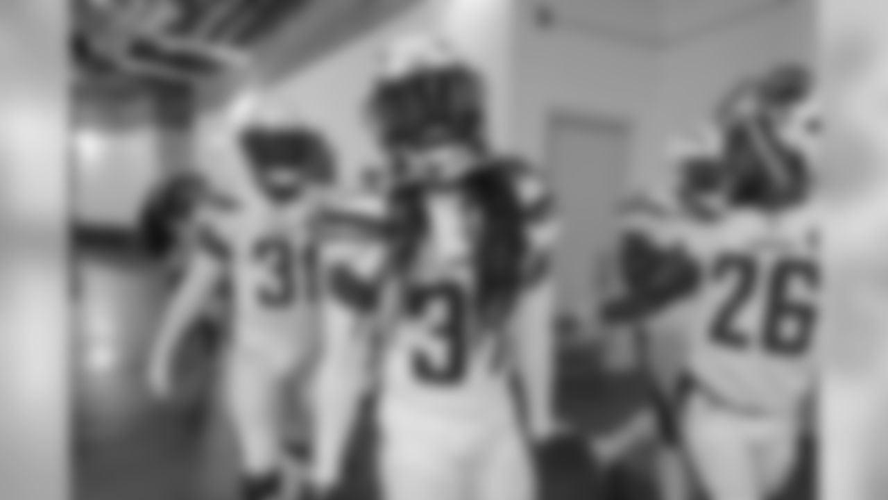 Adrian Phillips, Jahleel Addae and Casey Hayward walk out to the field to warm up before the Week 17 contest against the Denver Broncos.