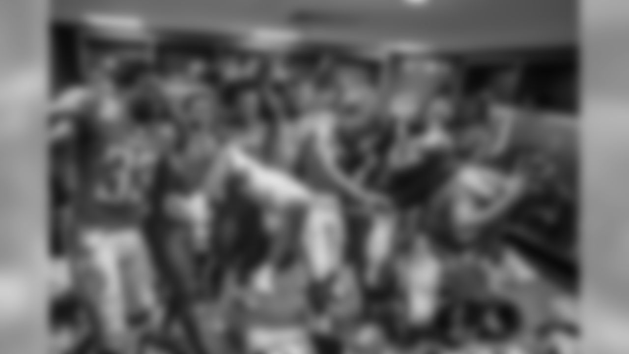 3 - Victory in London: "This photo was special since it was one of the last frames taken at the end of a long two weeks of travel and a victory over the Tennessee Titans in London. Check out how pumped these players were to walk out of Wembley with a W."