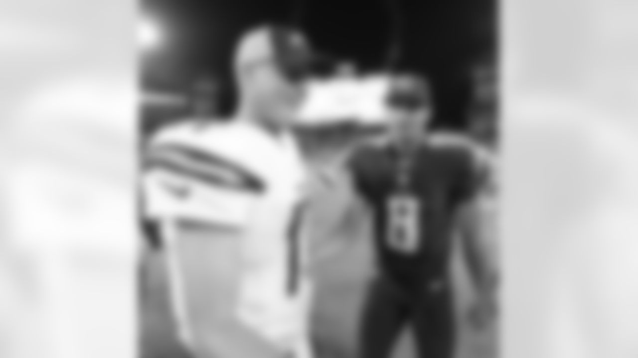 San Diego Chargers quarterback Philip Rivers, left, speaks with Tennessee Titans quarterback Marcus Mariota (8) after the second half of an NFL preseason football game, Saturday, Aug. 13, 2016, in Nashville, Tenn. The Tennessee Titans won 27-10. (AP Photo/Mark Zaleski)