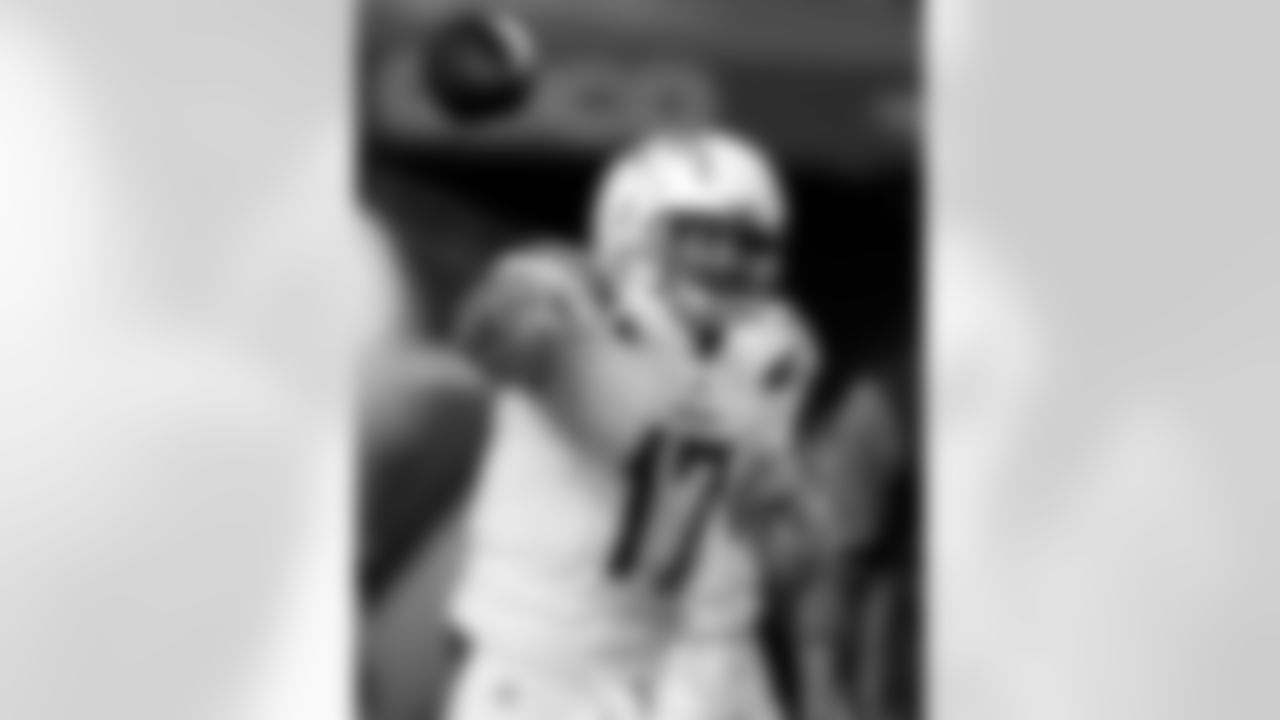 Los Angeles Chargers quarterback Philip Rivers (17) warms up prior to an NFL football game against the Denver Broncos, Monday, Sept. 11, 2017, in Denver. (AP Photo/David Zalubowski)