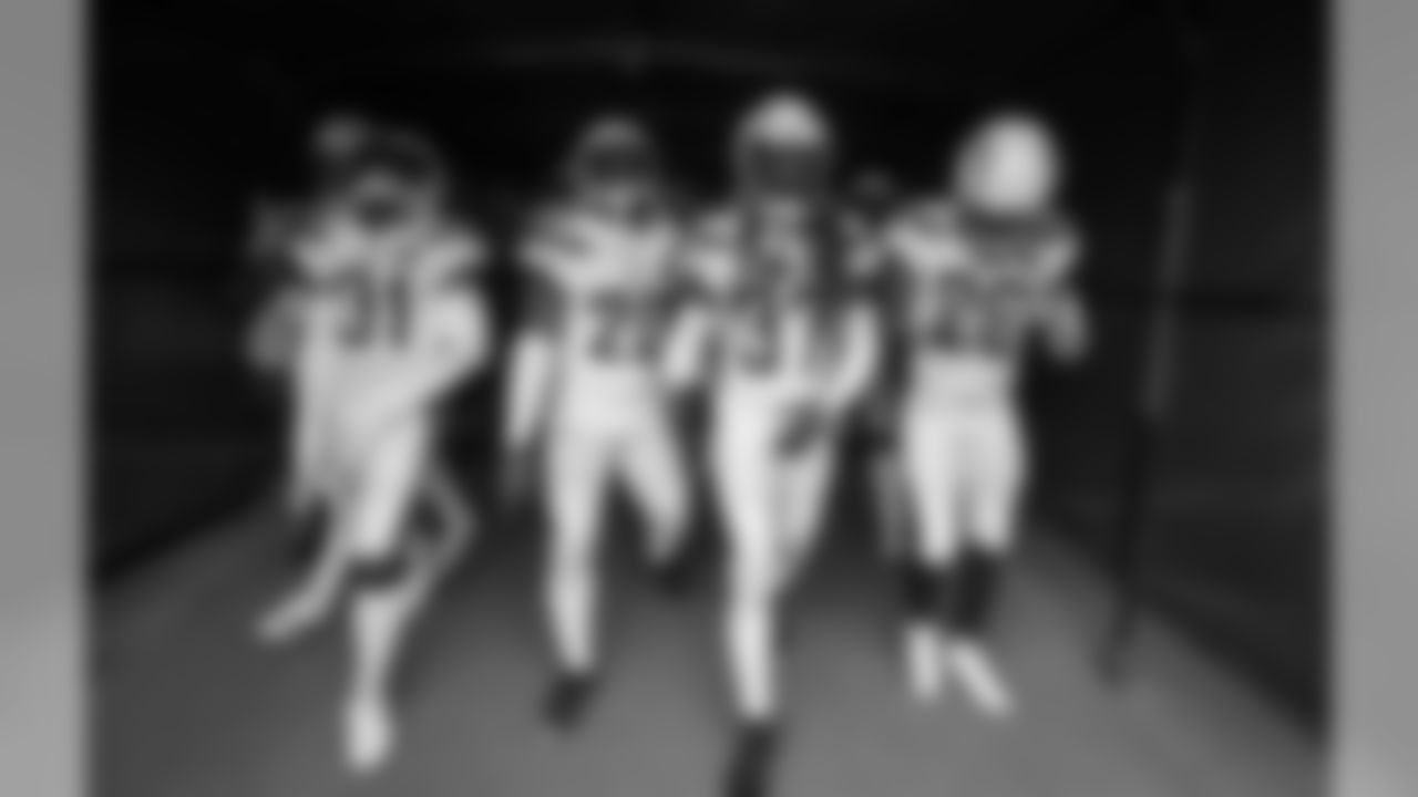 The Bolts walk out to the field to warm up before the Week 17 contest against the Denver Broncos.