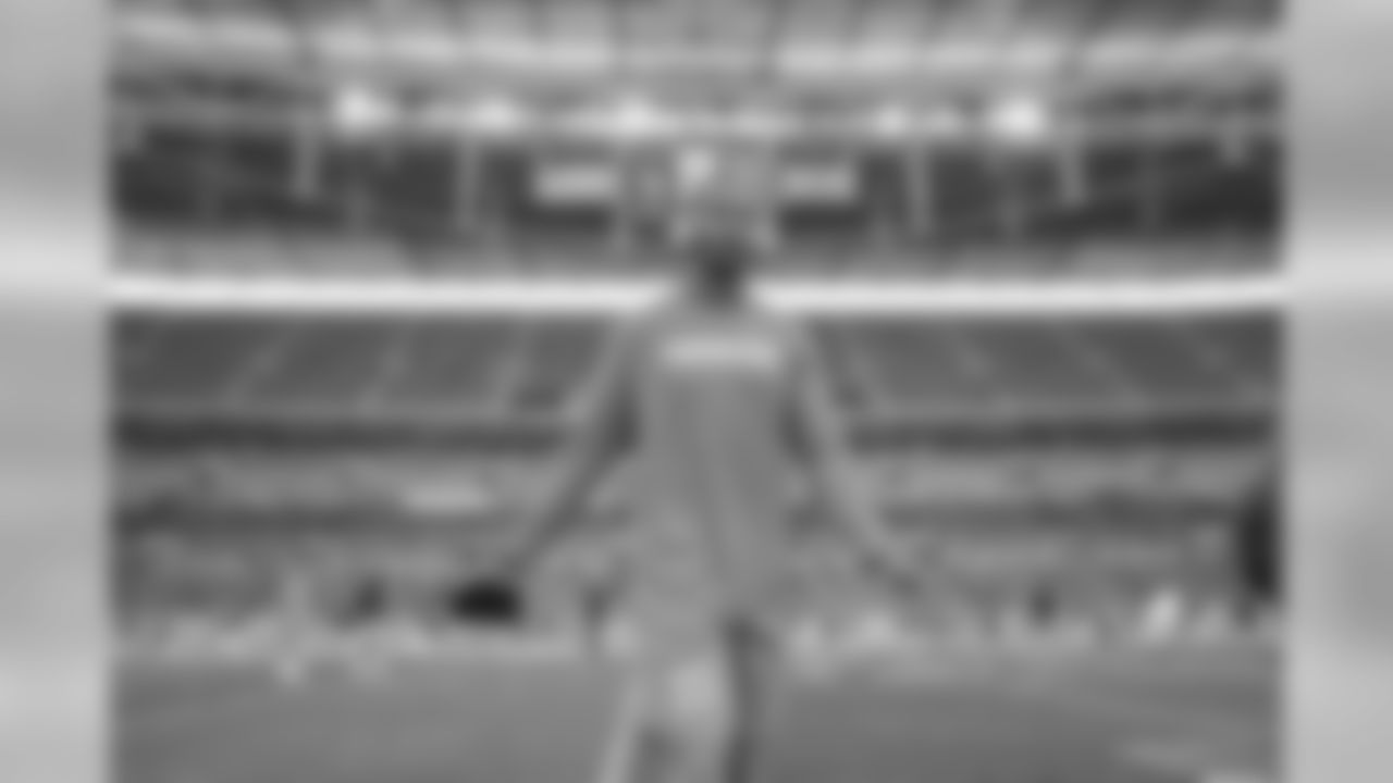Rayshawn Jenkins poses on the field at Wembley Stadium in London before the Week 7 matchup against the Tennessee Titans.