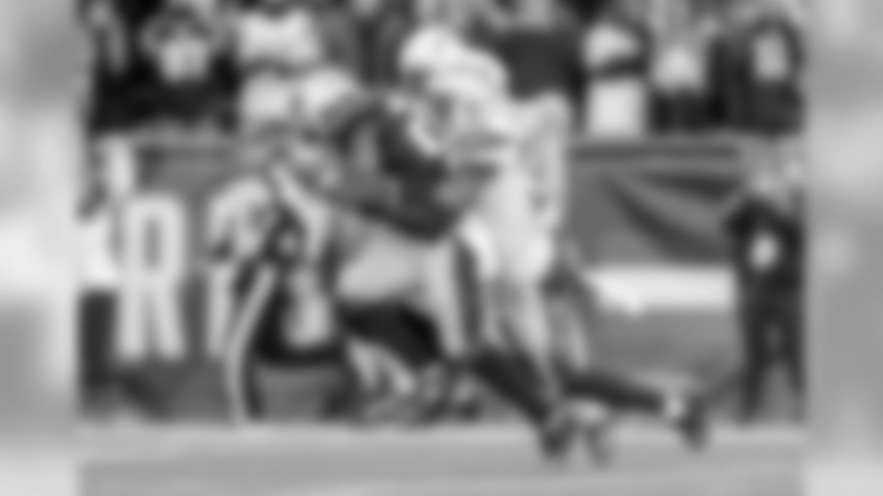 Derwin James tackles during the Divisional Round matchup against the New England Patriots at Gillette Stadium.