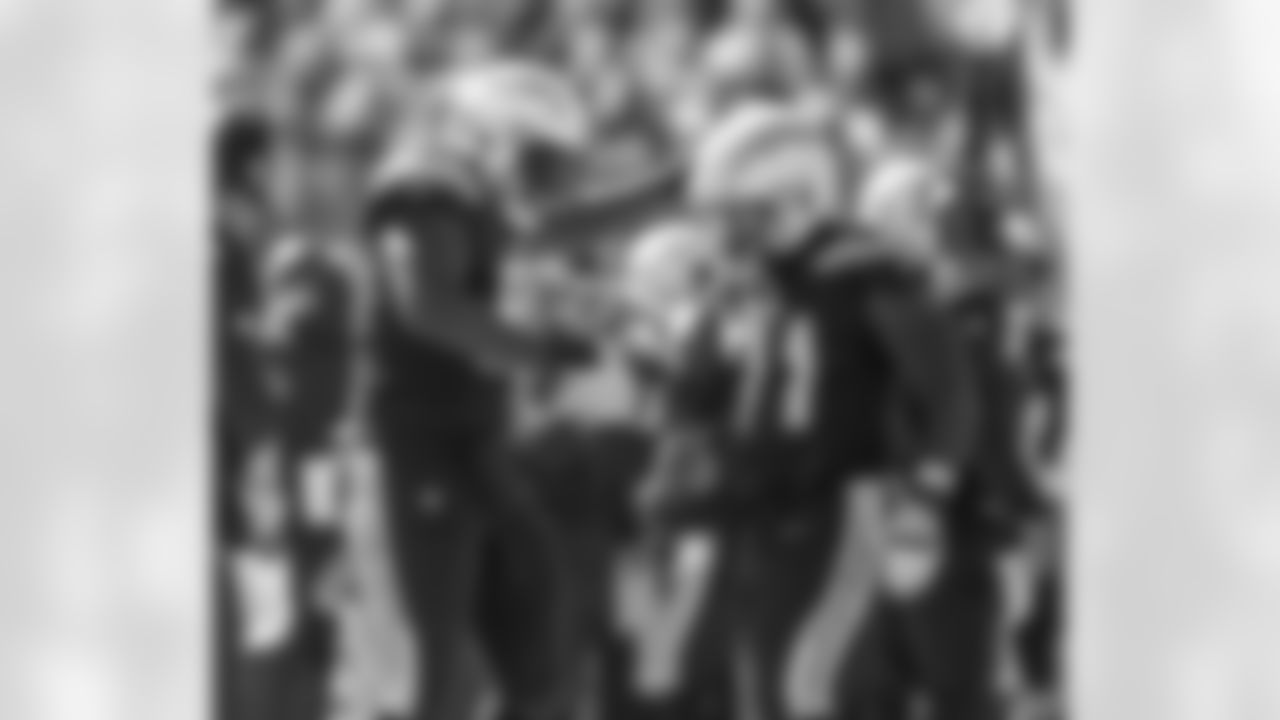 Justin Jones and Damion Square celebrate Square's sack of Browns' QB Baker Mayfield during the Week 6 matchup against the Cleveland Browns.