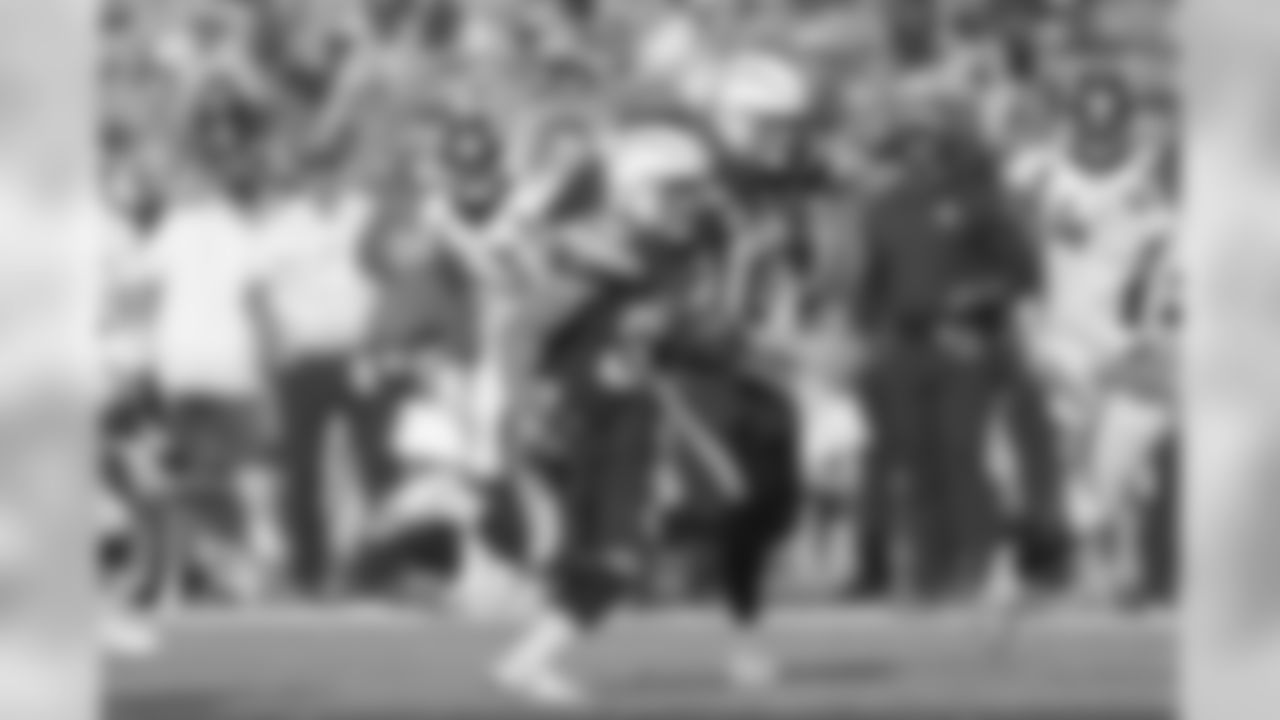 Austin Ekeler runs downfield while Philip Rivers blocks for him during the Week 11 matchup against the Denver Broncos from ROKiT Field at StubHub Center.