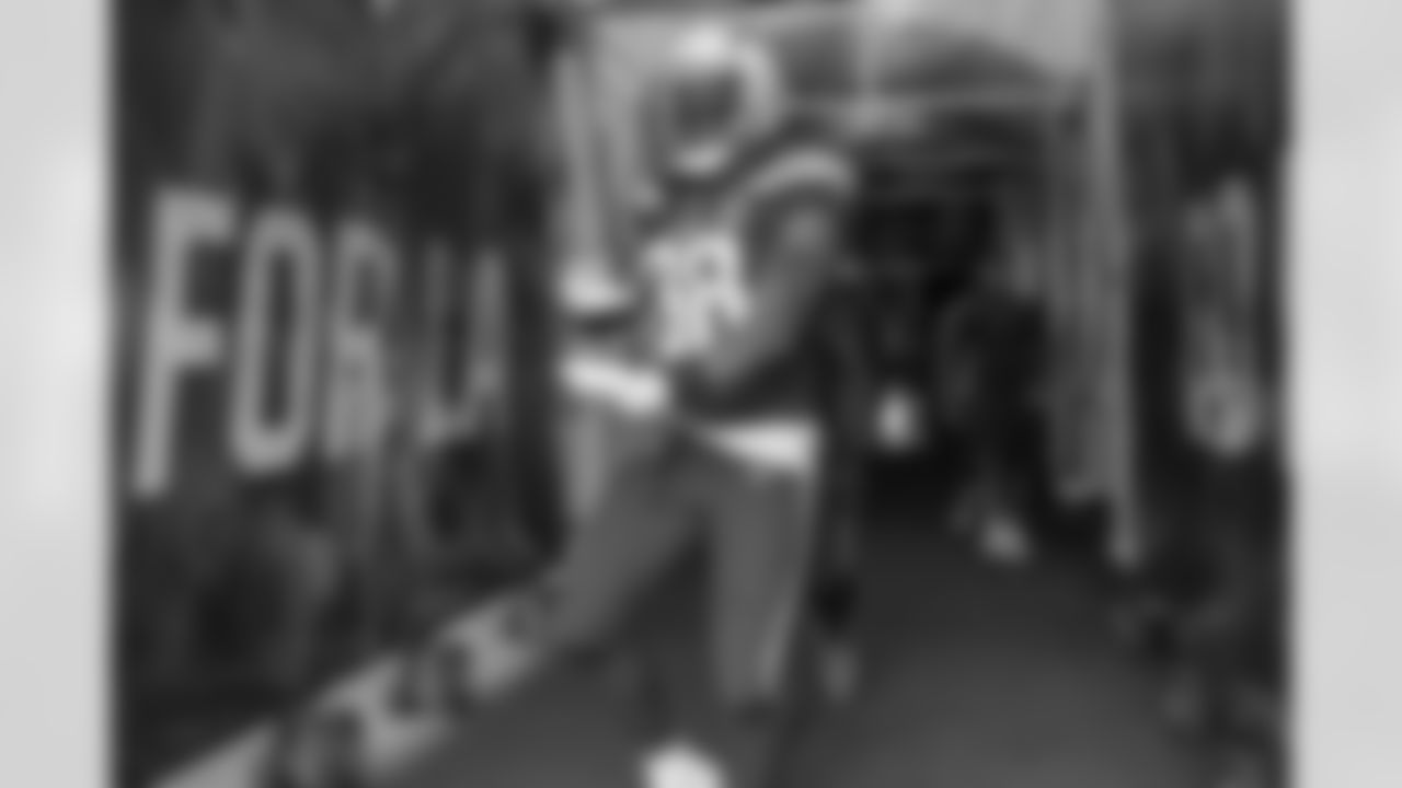 Virgil Green walks out to the field before the Week 14 matchup against the Cincinnati Bengals at ROKiT Field at StubHub Center.