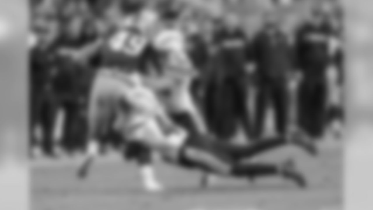 Marcus Edmonds and Nick Dzubnar make a tackle against the San Francisco 49ers during the last preseason game.