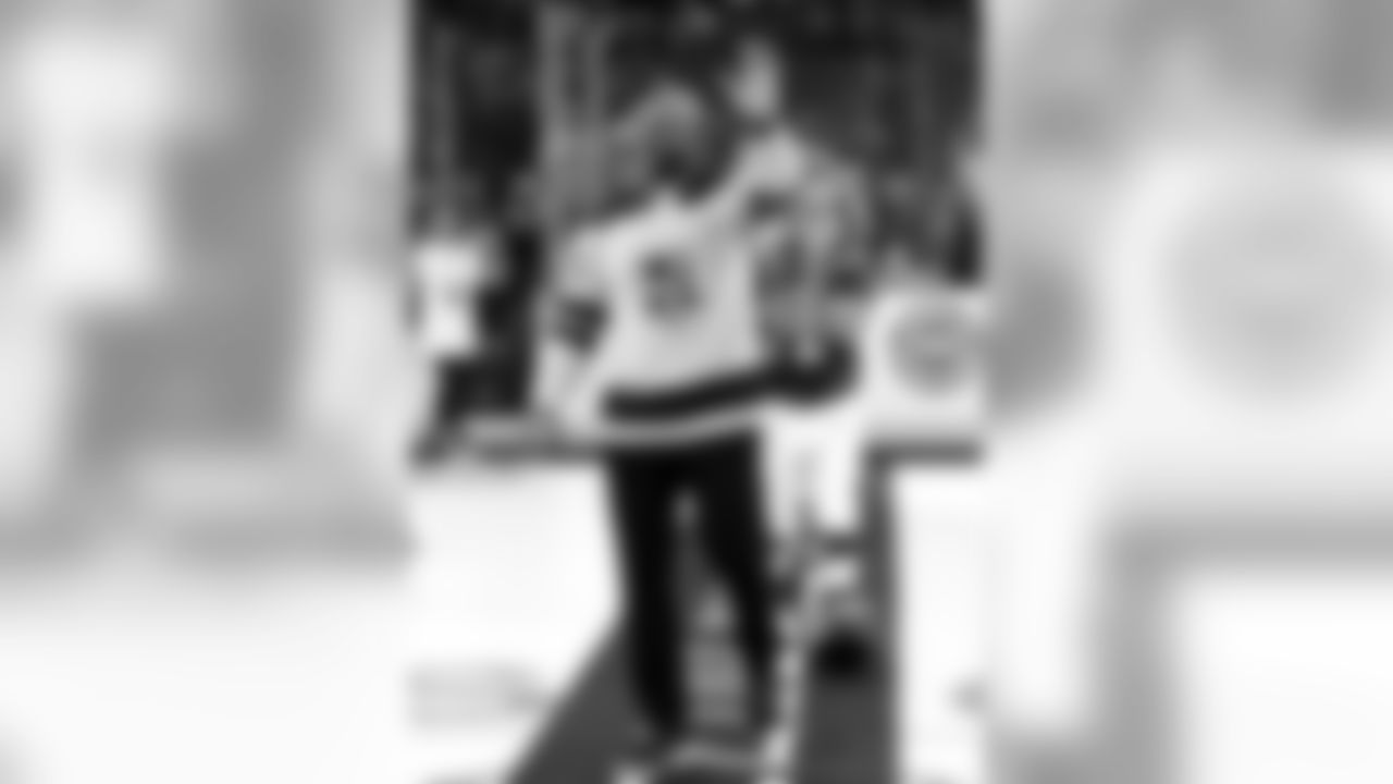 Chargers legend Marcellus Wiley waves as he walks out for a ceremonial puck drop during the Winnipeg Jets vs. Kings game on December 18, 2018 at STAPLES Center.