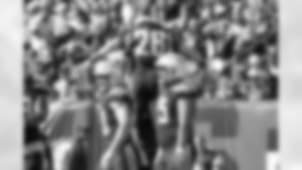 Dan Feeney lifts up Melvin Gordon after Gordon scored a touchdown during the Week 6 matchup against the Cleveland Browns.