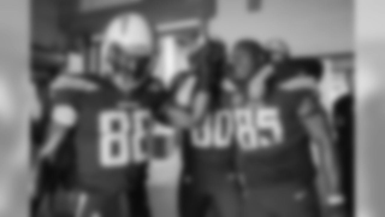 Virgil Green, Sean Culkin and Antonio Gates huddle up before taking the field against the Cleveland Browns.