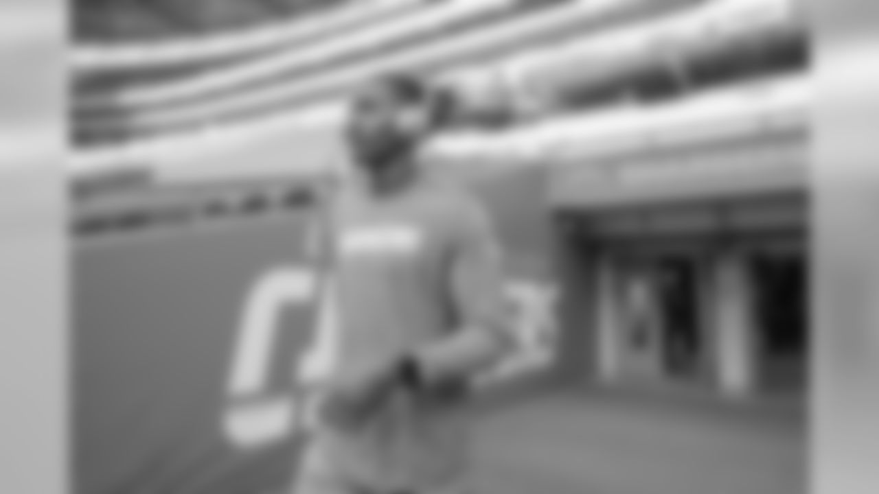 Rayshawn Jenkins walks out to the field to warm up Wembley Stadium in London before the Week 7 matchup against the Tennessee Titans.