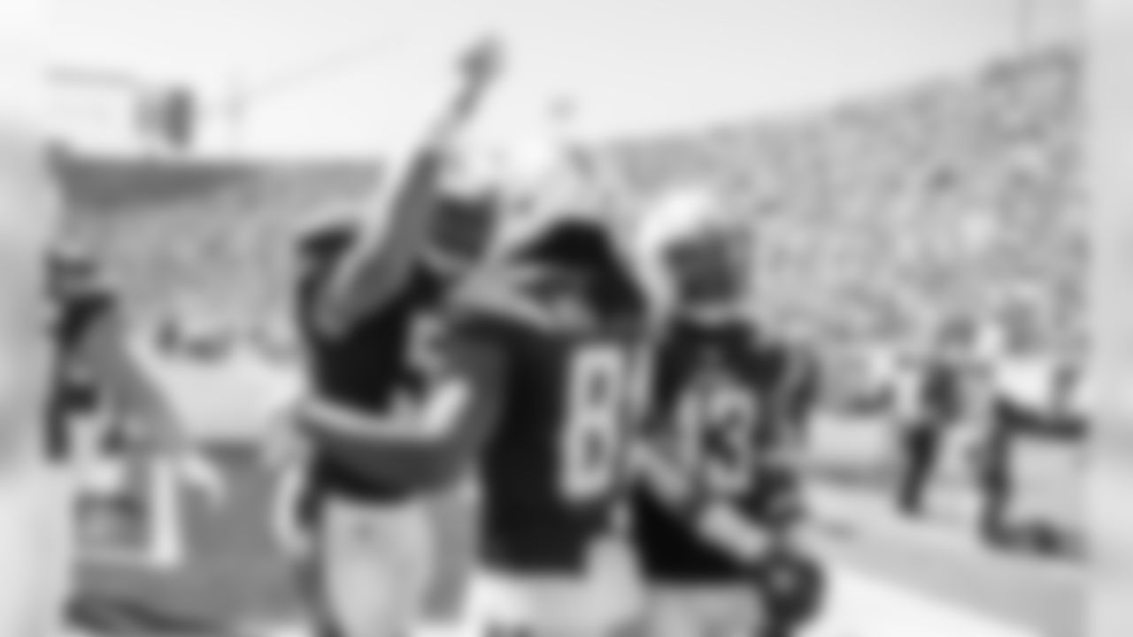 Mike Pouncey and Keenan Allen congratulate Mike Williams on his second touchdown of the day during the Bolts' Week 3 matchup against the Rams at the LA Memorial Coliseum.