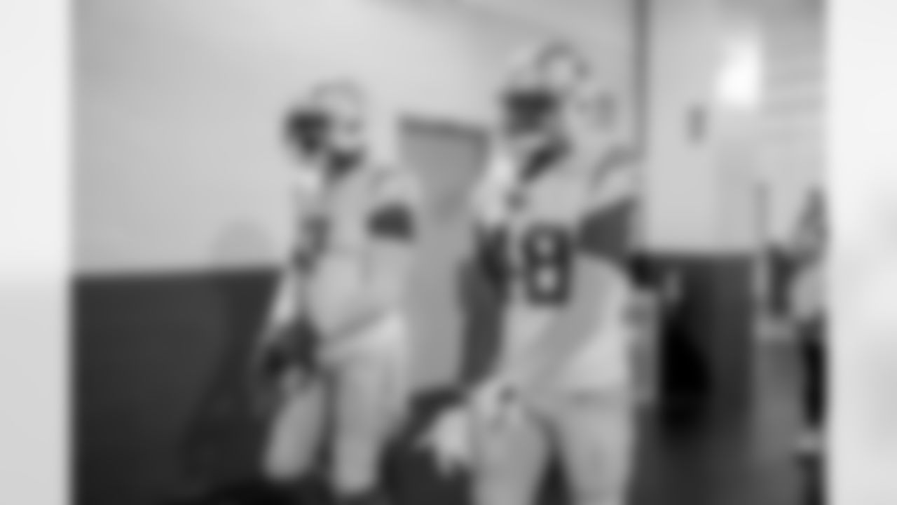 The Los Angeles Chargers prepare to play against the Arizona Cardinals at State Farm Stadium on November 27, 2022 in Glendale, Arizona.