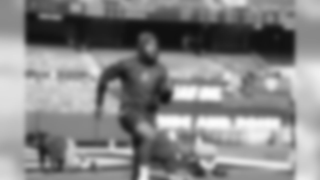 Adrian Phillips warms up at Oakland-Alameda County Coliseum before the Week 10 matchup against the Oakland Raiders.