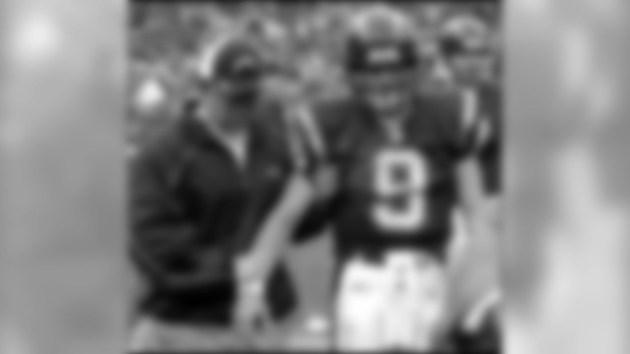 San Diego Chargers quarterback Drew Brees (9) is escorted from the field after injuring his right shoulder during the second quarter of an NFL football game against the Denver Broncos, Saturday, Dec. 31, 2005, in San Diego. (AP Photo/Denis Poroy)