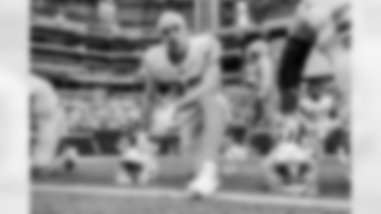 The Los Angeles Chargers prepare to play against the Arizona Cardinals at State Farm Stadium on November 27, 2022 in Glendale, Arizona.