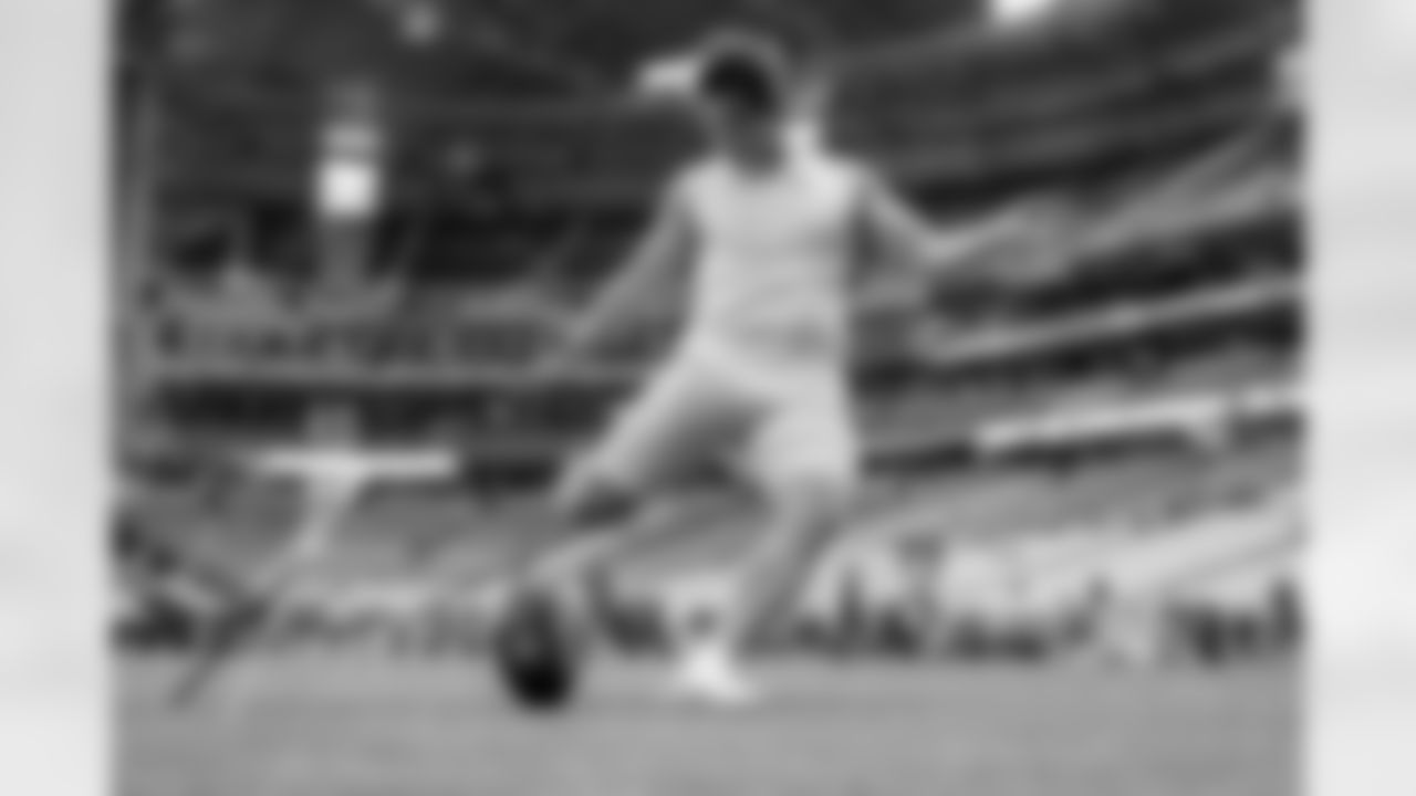 The Los Angeles Chargers prepare to play against the Arizona Cardinals at State Farm Stadium on November 27, 2022 in Glendale, Arizona.
