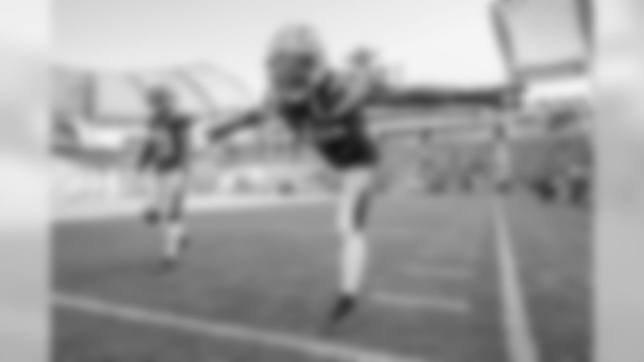 Craig Mager and Tony Brown warm up at ROKiT Field at StubHub Center before facing the New Orleans Saints in the Bolts' third preseason game.