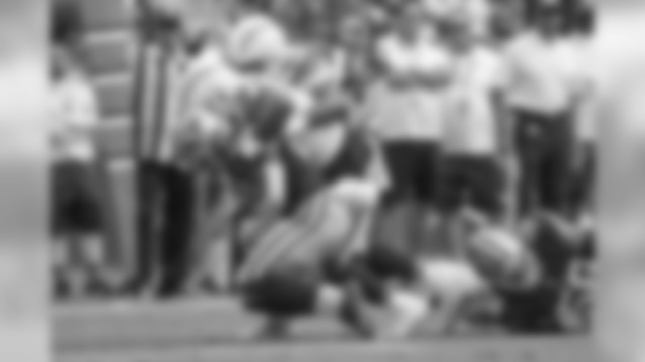 Damion Square and Denzel Perryman make a tackle during the Bolts' matchup against the 49ers at ROKiT Field at StubHub Center.