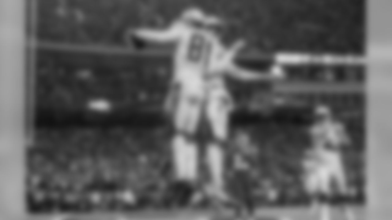 Mike Williams and Tyrell Williams celebrate Mike's touchdown during the Thursday night matchup against the Kansas City Chiefs at Arrowhead Stadium.