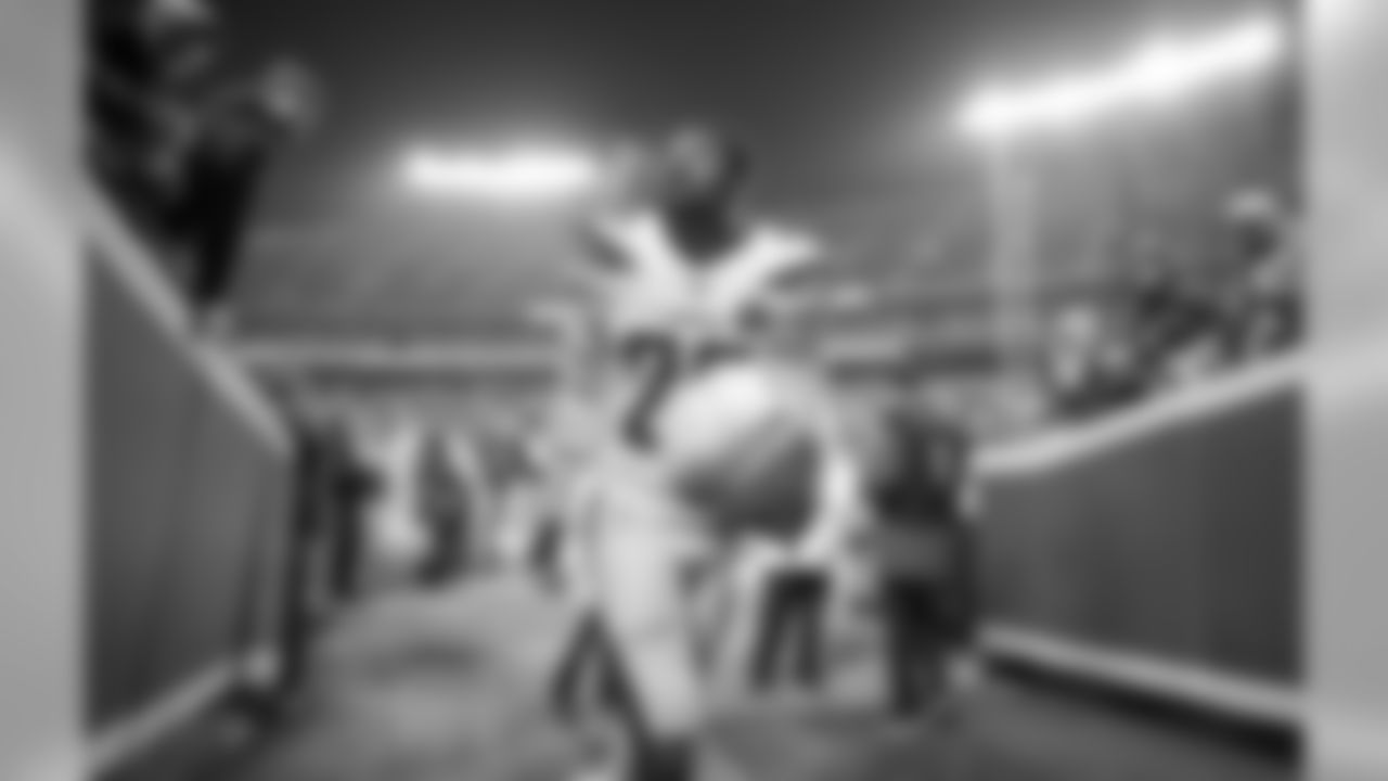 Jeff Richards walks back to the locker room after warming up at Arrowhead Stadium before the Thursday night matchup against the Kansas City Chiefs.