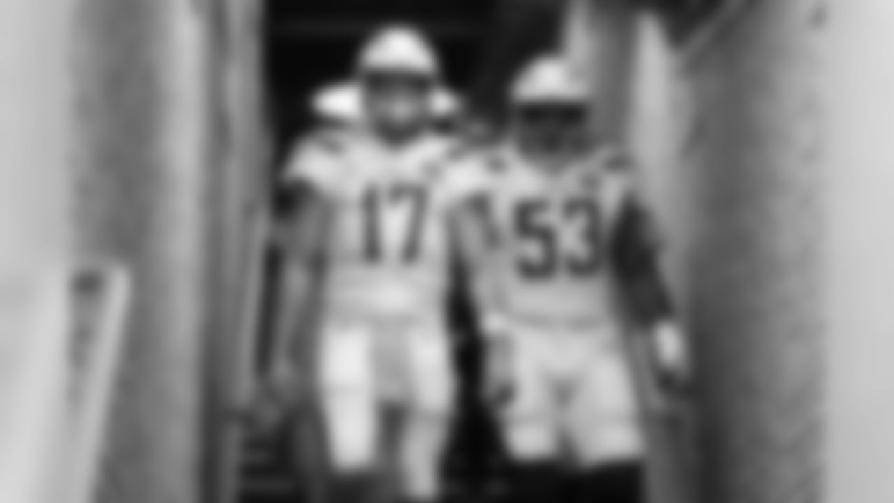 Philip Rivers and Mike Pouncey walk out to the field at Oakland-Alameda County Coliseum before the Week 10 matchup against the Oakland Raiders.