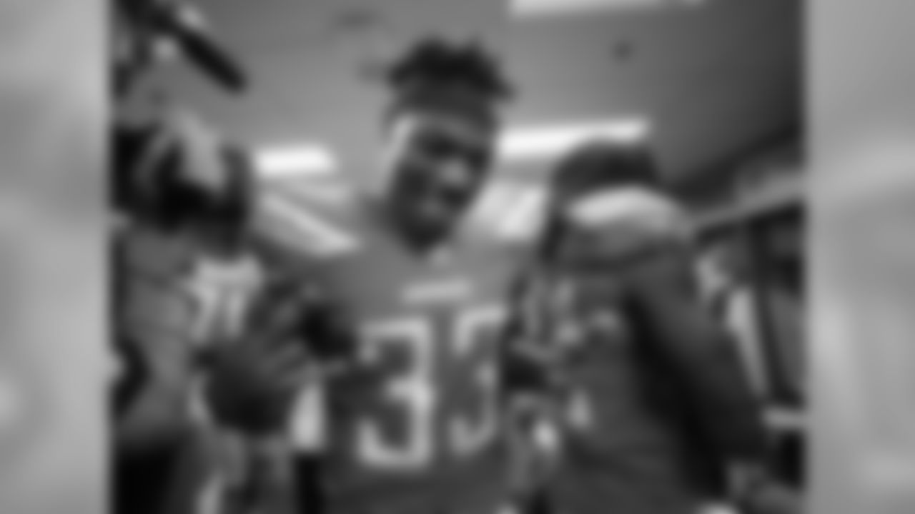 Derwin James celebrates the Bolts 26-10 victory over the Oakland Raiders in the locker room postgame.
