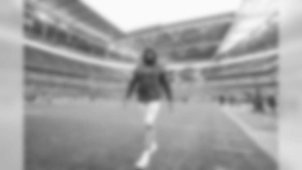Jatavis Brown walks out to the field to warm up at Wembley Stadium in London before the Week 7 matchup against the Tennessee Titans.