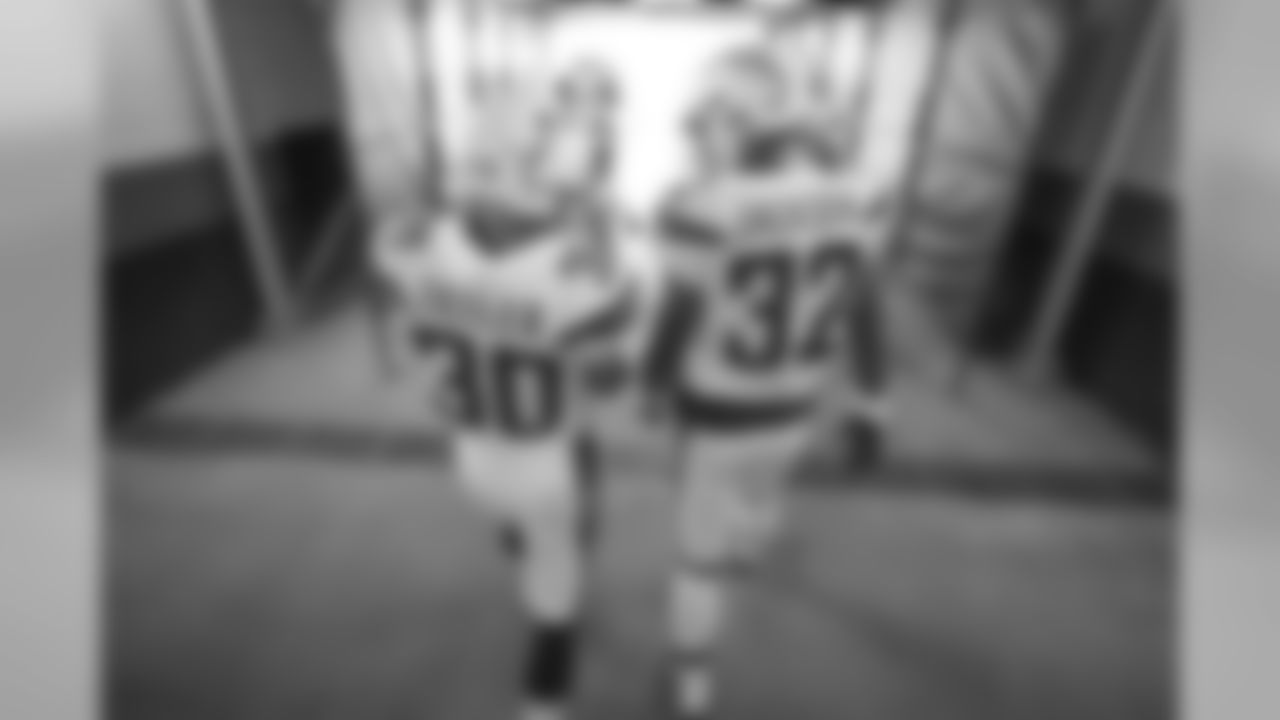 Austin Ekeler and Justin Jackson walk out to the field to warm up before the Week 17 contest against the Denver Broncos.