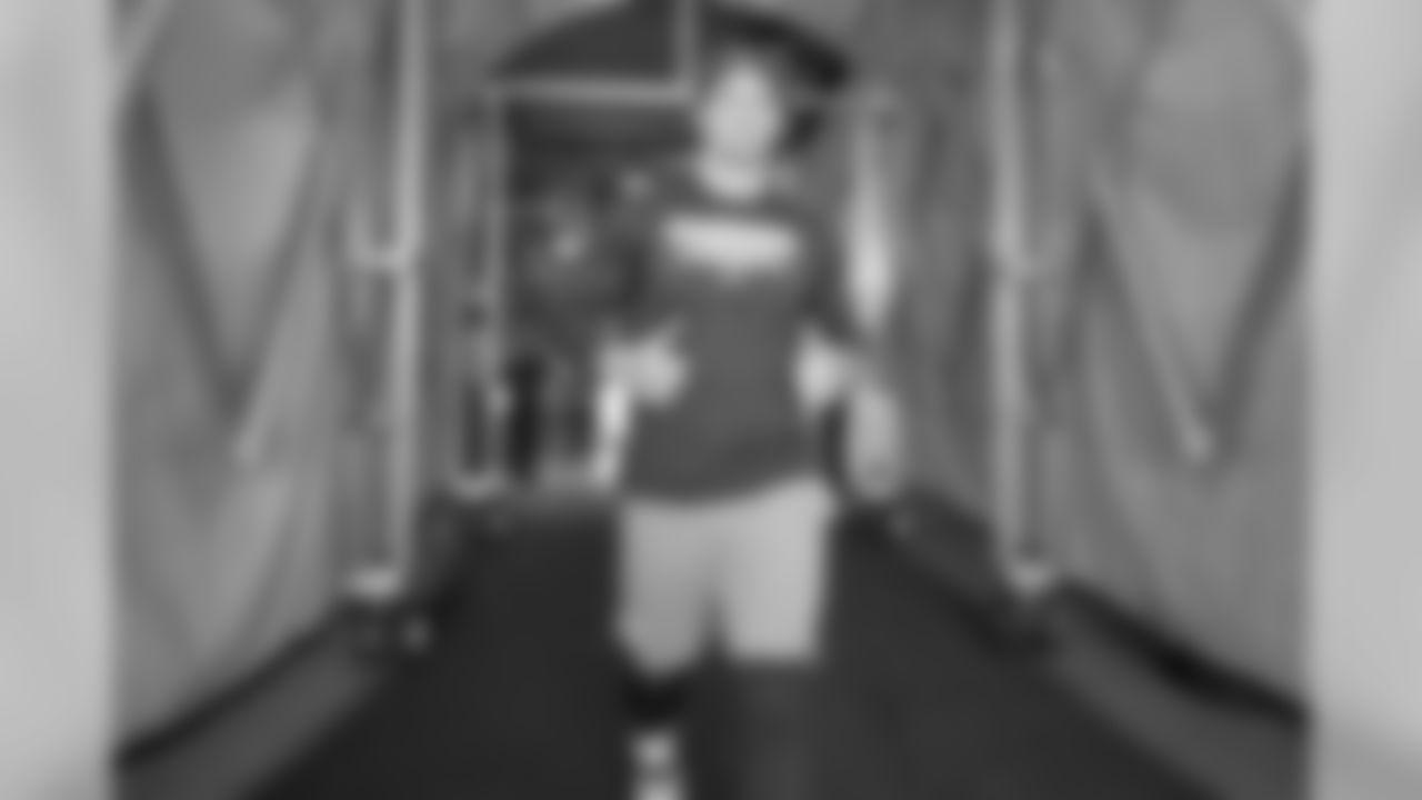 Joey Bosa walks out to the field to warm up before the Week 11 contest against the Denver Broncos.