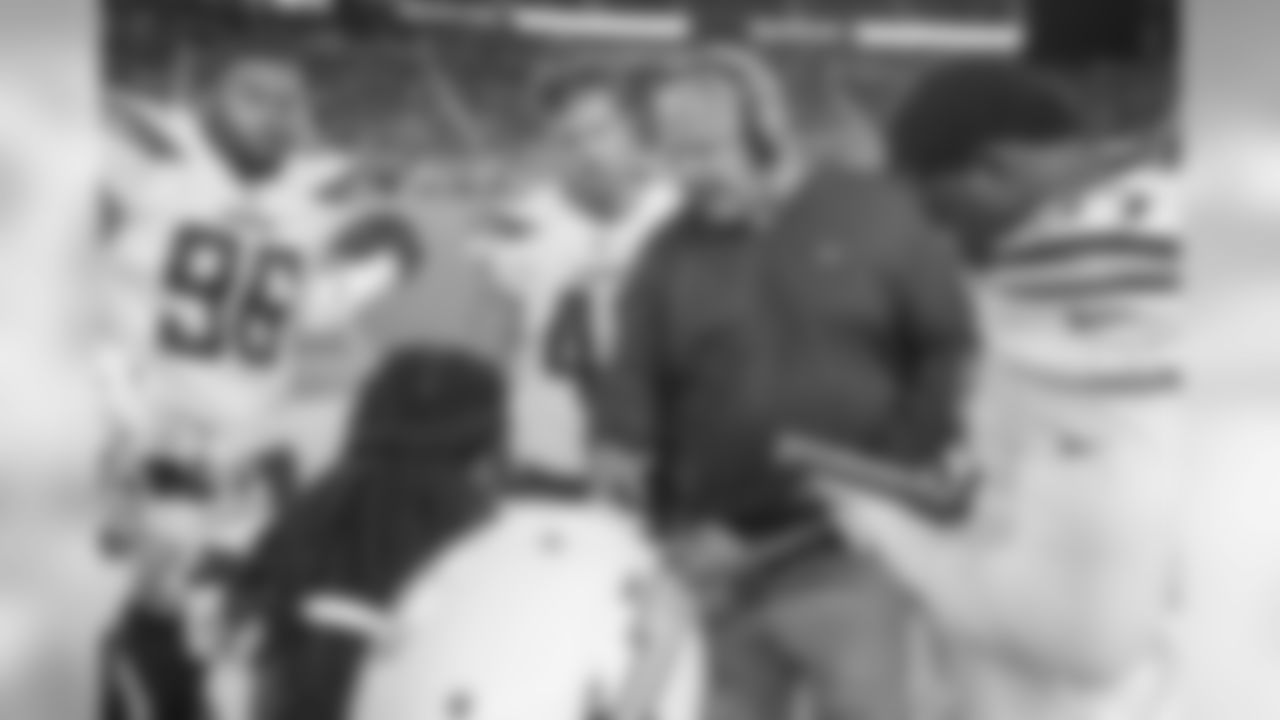 Linebackers coach Richard Smith talks with players during the Bolts' last preseason game.