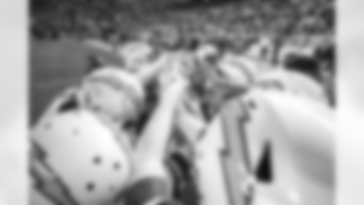 The Bolts huddle on the field before the Week 13 matchup against the Pittsburgh Steelers at Heinz Field.