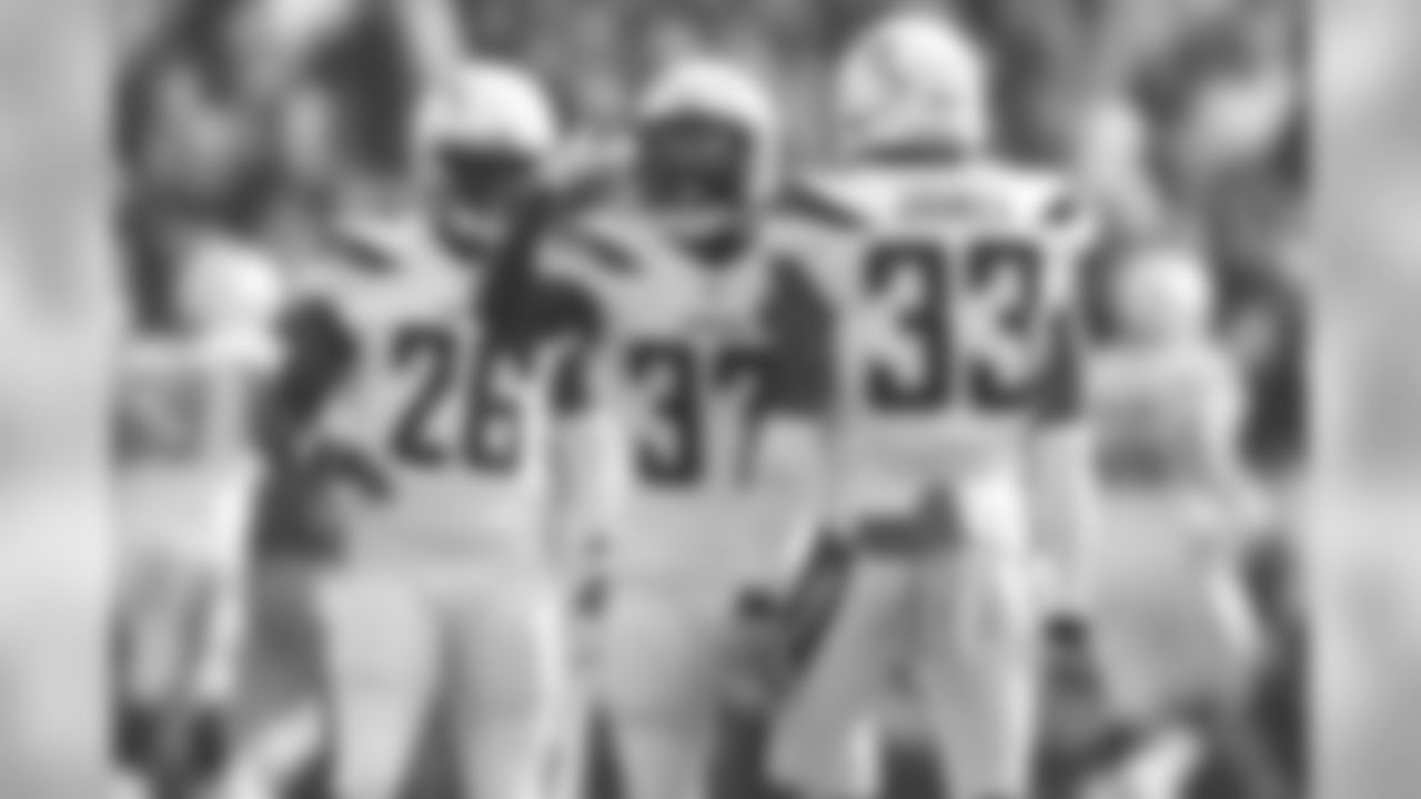 Casey Hayward, Jahleel Addae and Derwin James celebrate a tackle during the Week 10 matchup against the Oakland Raiders at Oakland-Alameda County Coliseum.