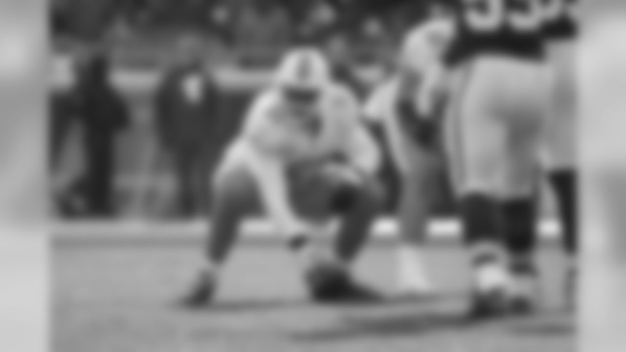 Miami Dolphins center Mike Pouncey prepares to snap the ball in action against the Kansas City Chiefs during a NFL football game on Sunday, Dec. 24, 2017, in Kansas City, Mo. The Chiefs won, 29-13. (G. Newman Lowrance via AP)