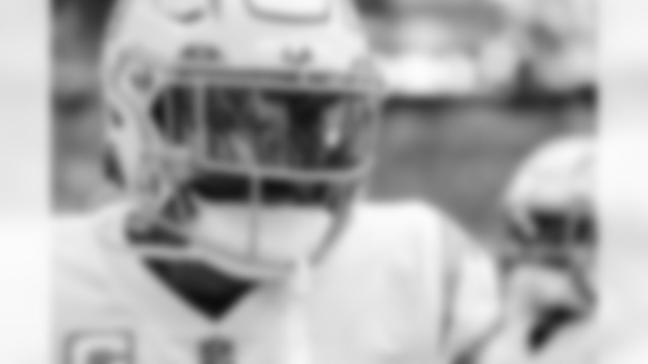 The Los Angeles Chargers prepare to play against the Arizona Cardinals at State Farm Stadium on November 27, 2022 in Glendale, Arizona.