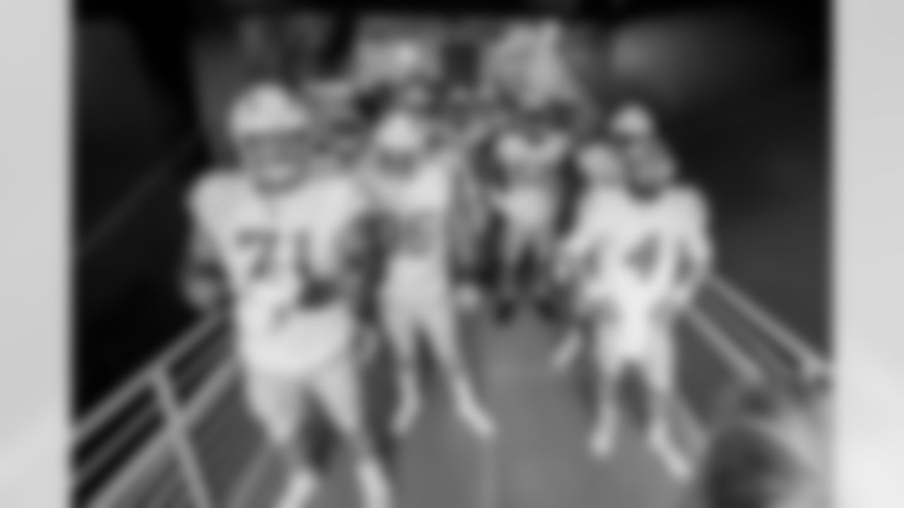 The Los Angeles Chargers prepare to play against the Arizona Cardinals at State Farm Stadium on November 27, 2022 in Glendale, Arizona.