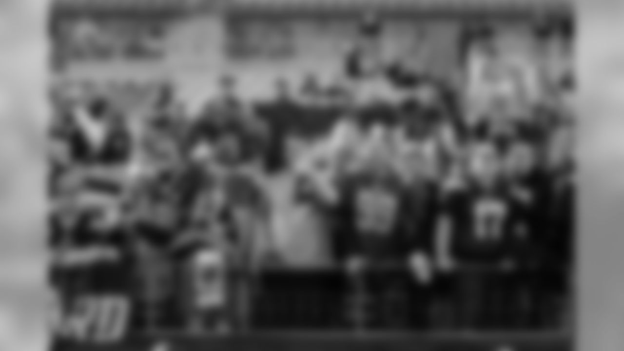 Chargers fans pose in the stands before the Week 13 matchup against the Pittsburgh Steelers at Heinz Field.