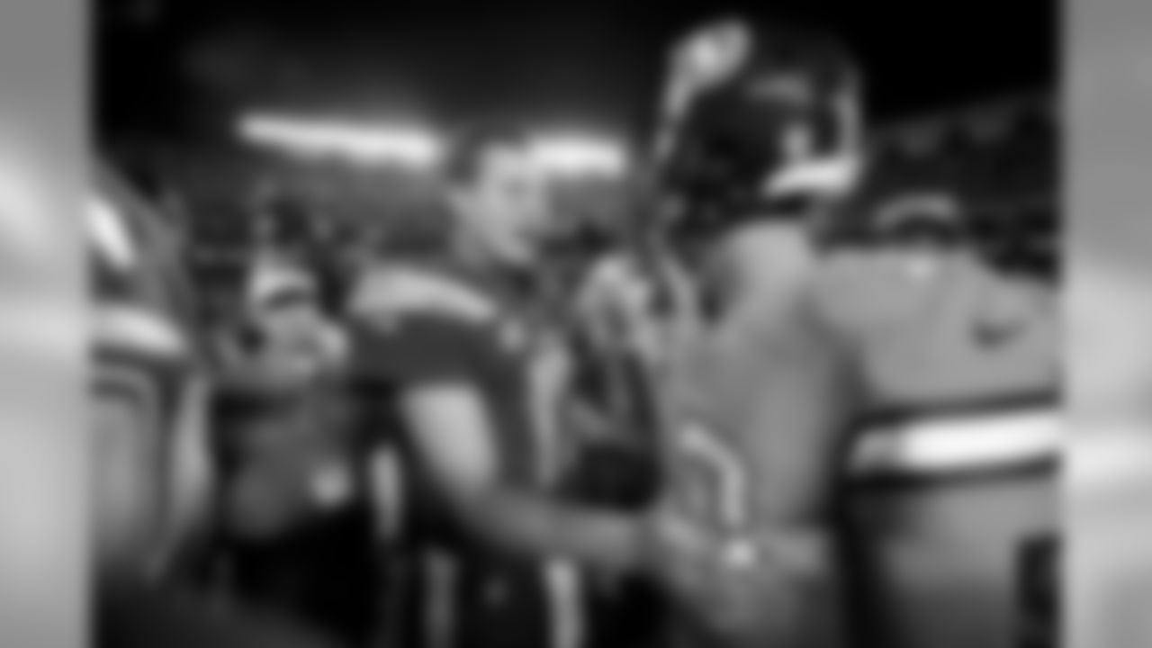 San Diego Chargers quarterback Philip Rivers, left, greets Denver Broncos quarterback Trevor Siemian, right, after an NFL football game Thursday, Oct. 13, 2016, in San Diego. The Chargers won, 21-13. (AP Photo/Denis Poroy)