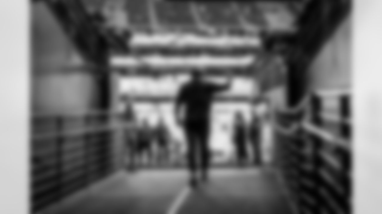 The Los Angeles Chargers prepare to play against the Arizona Cardinals at State Farm Stadium on November 27, 2022 in Glendale, Arizona.