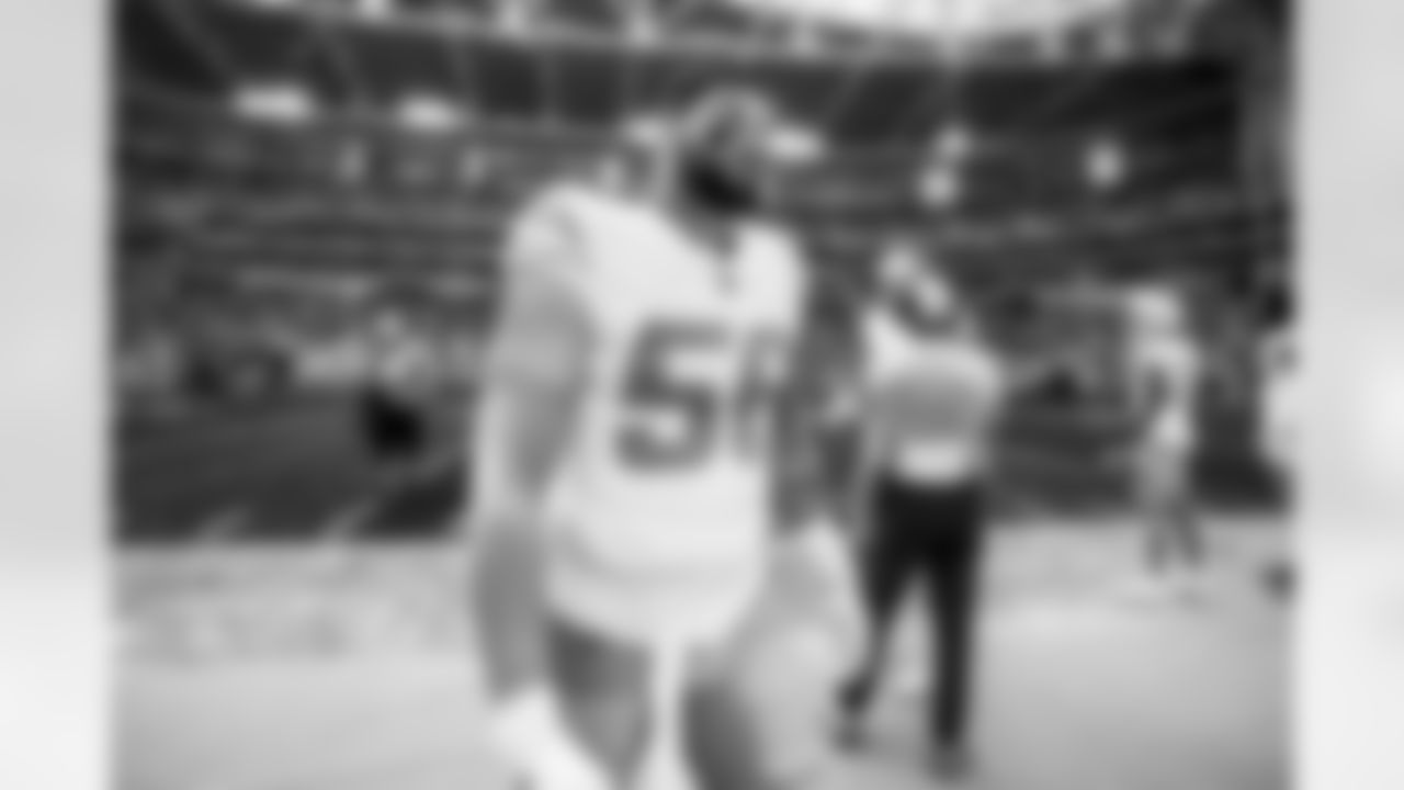 The Los Angeles Chargers prepare to play against the Arizona Cardinals at State Farm Stadium on November 27, 2022 in Glendale, Arizona.