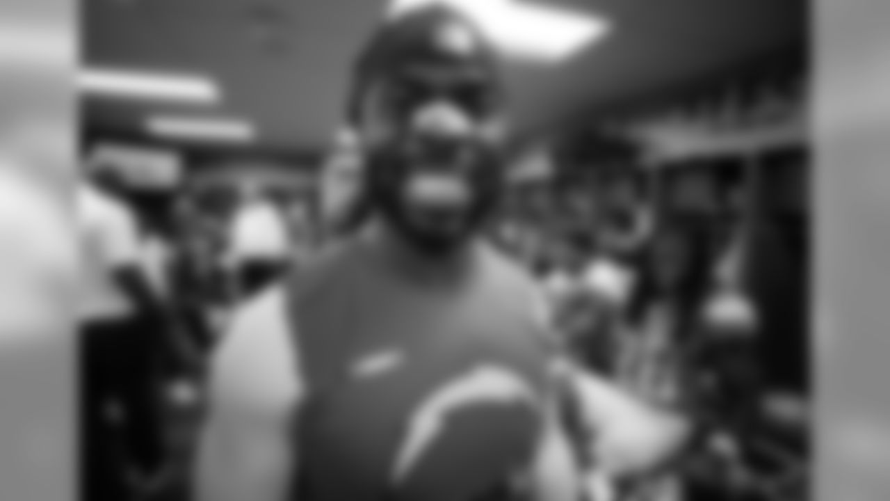 Jahleel Addae smiles after the Bolts 26-10 victory over the Oakland Raiders in the locker room postgame.
