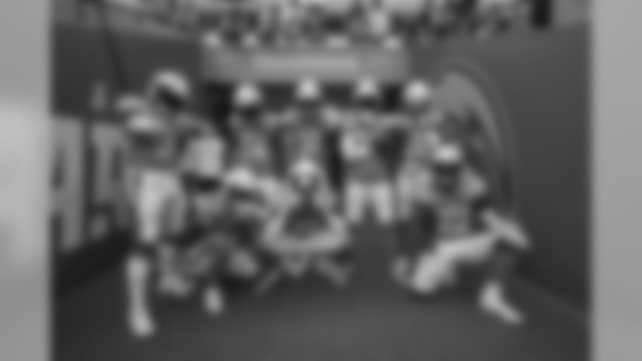 The Bolts pose in the tunnel at Wembley Stadium in London before the Week 7 matchup against the Tennessee Titans.