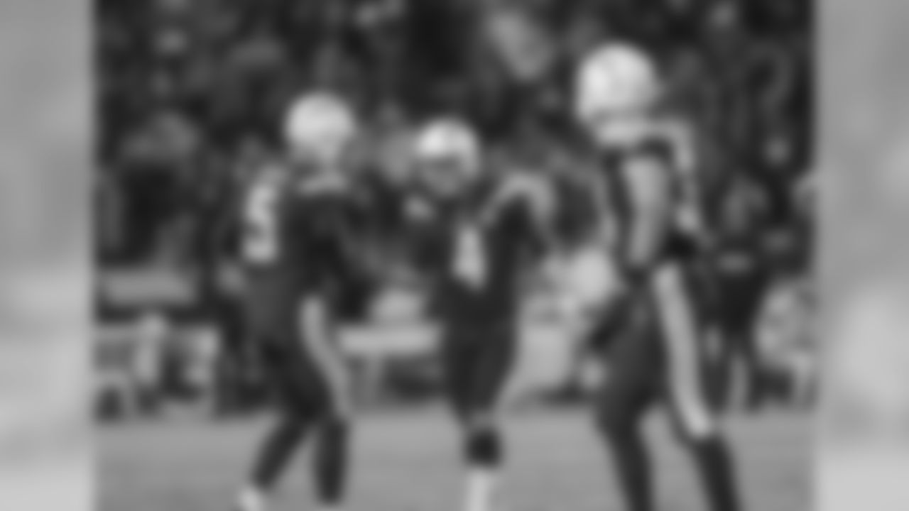 Donnie Jones and Michael Badgley slap hands after a successful field goal during the Week 16 matchup against the Baltimore Ravens at ROKiT Field at StubHub Center.