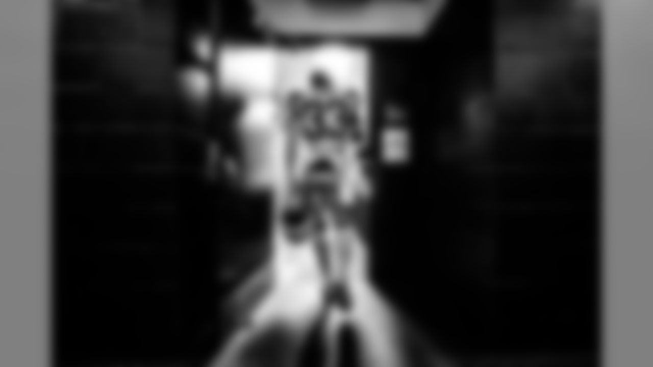 2 - Thirty-Three: "Derwin James, the team's 2018 first-round pick, enters the locker room prior to playing the San Francisco 49ers. One of the things I like about this shot is the contrast of the brick and bright lights coming from the locker room."