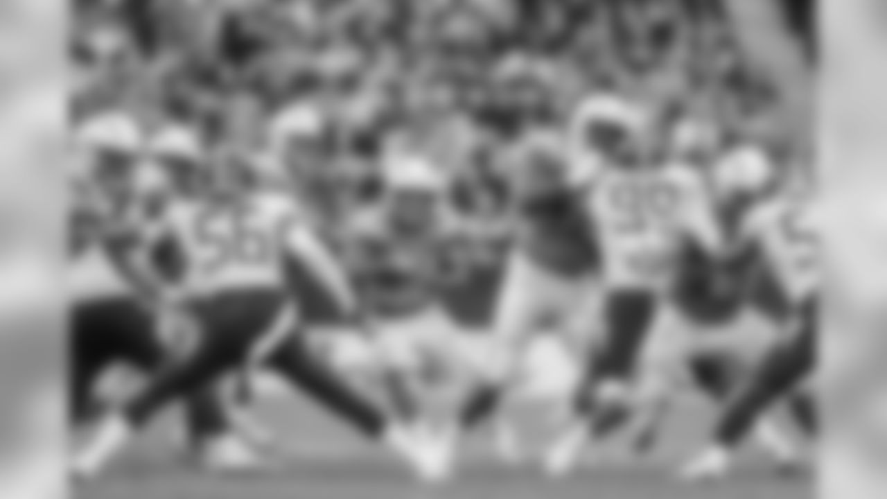 Austin Ekeler looks to run downfield during the Week 7 contest against the Tennessee Titans at Wembley Stadium in London.
