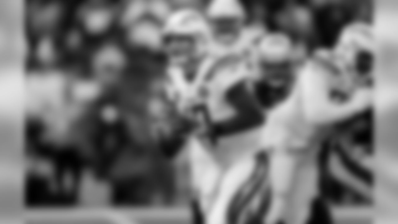 Philip Rivers holds the ball during the Divisional Round matchup against the New England Patriots at Gillette Stadium.