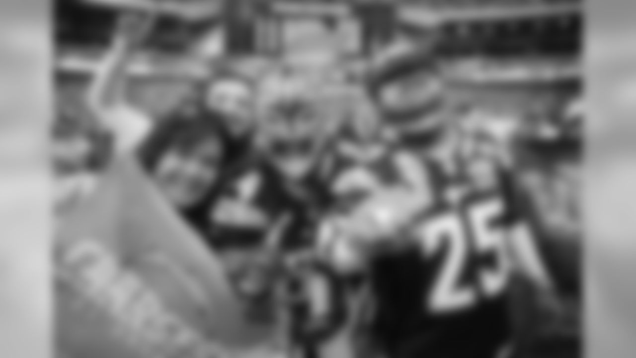 Los Angeles Chargers fans react before an NFL football game against Tennessee Titans at Wembley stadium in London, Sunday, Oct. 21, 2018. (AP Photo/Matt Dunham)