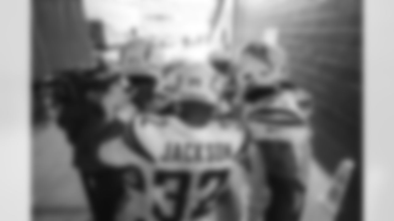 The Bolts huddle up before the Divisional Round matchup against the New England Patriots at Gillette Stadium.